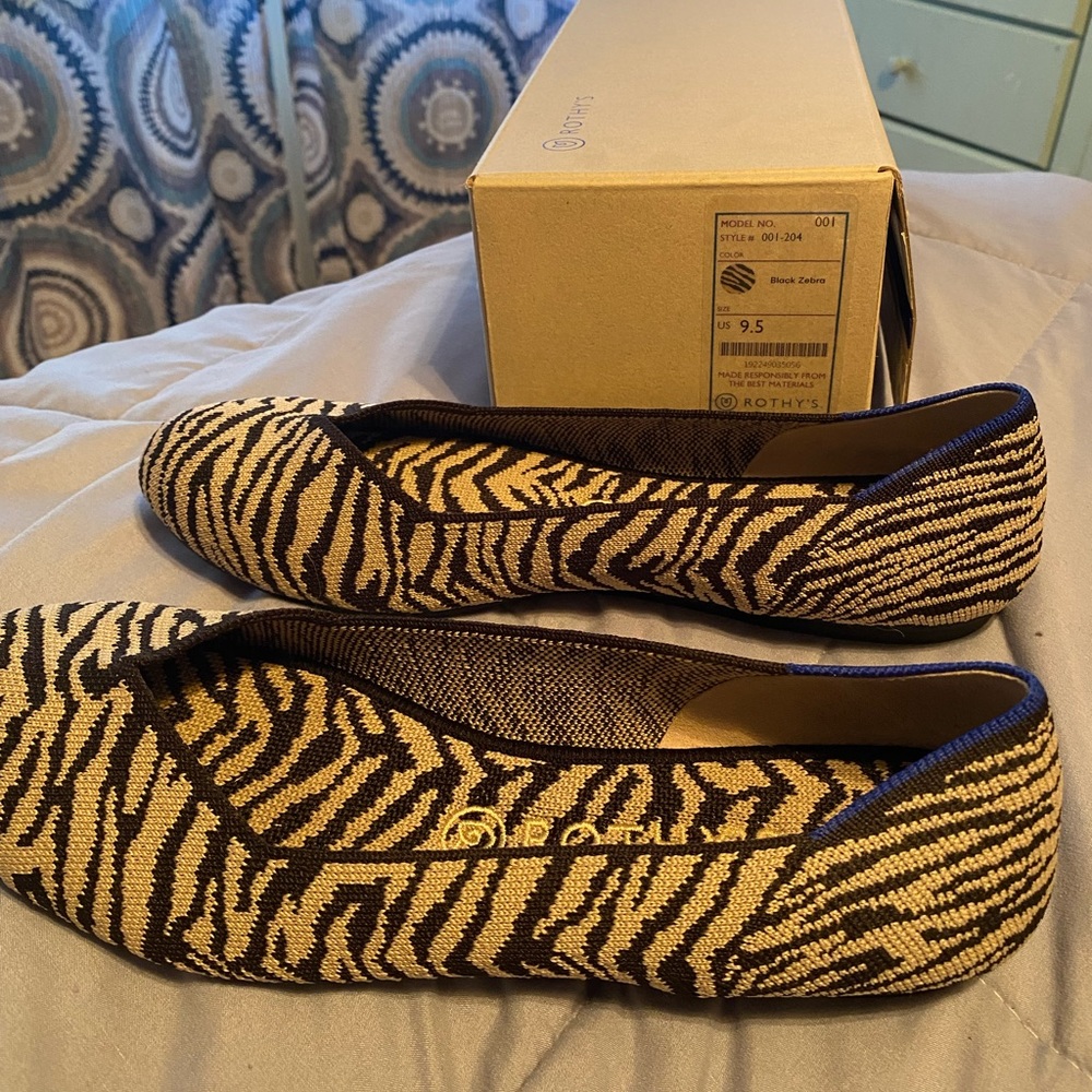 Rothy’s 9.5 flat. Black zebra print